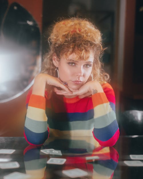 Retro Style Portrait of Woman with Curly Hair Playing Cards