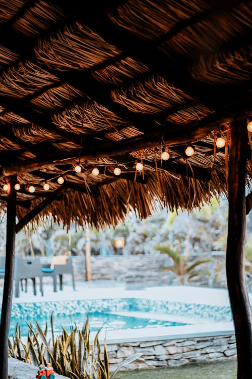 View of Swimming Pool from under Straw Shelter