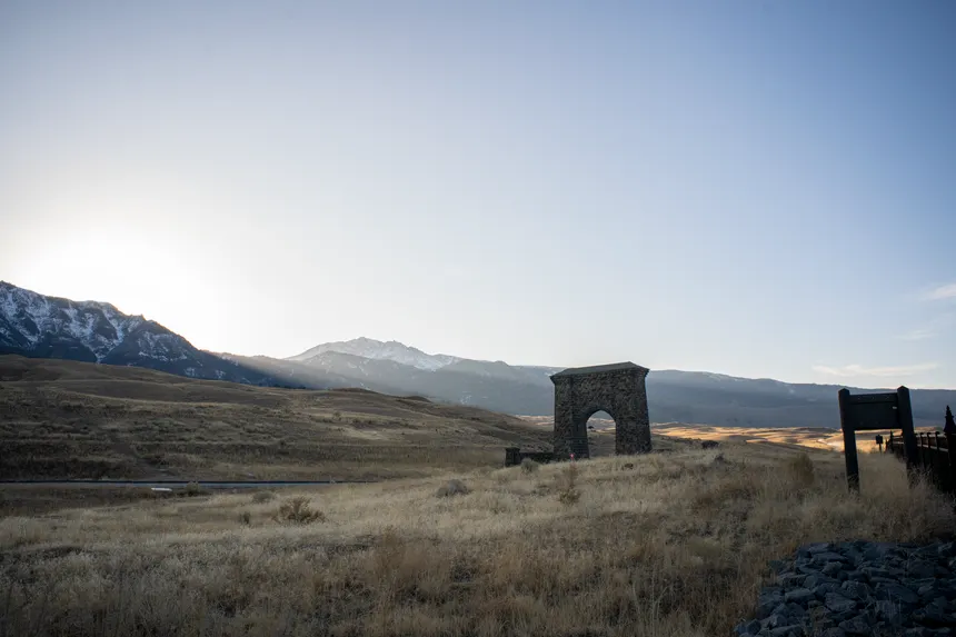Beautiful landscape featuring the iconic Roosevelt Arch in Montana's countryside.