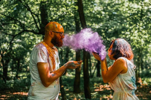 Man and Woman Playing with Powdered Paint