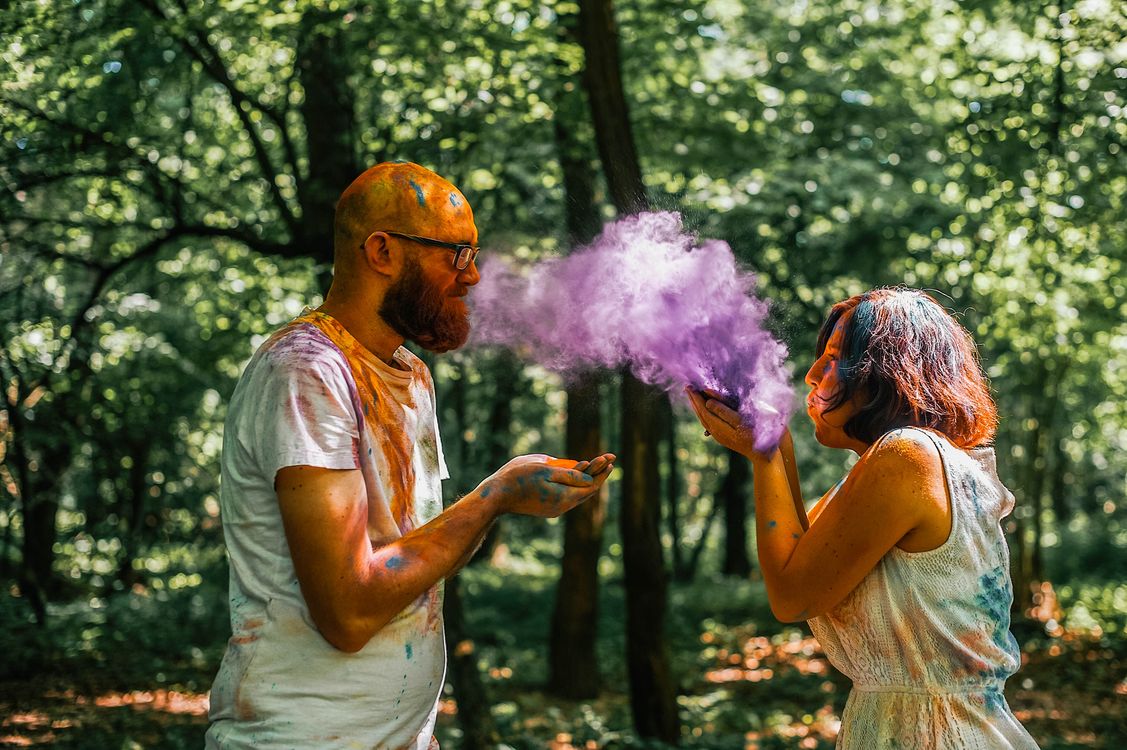 Powder Paint Playing Man and Woman Playing with Powdered Paint · Free Stock Photo