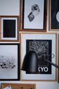 Framed Prints on Wall and Desk Lamp