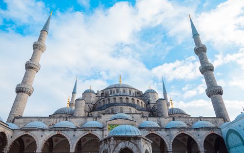 Free Beautiful low angle shot of the iconic Blue Mosque in Istanbul with minarets and a clear blue sky, showcasing classic Ottoman architecture. Stock Photo