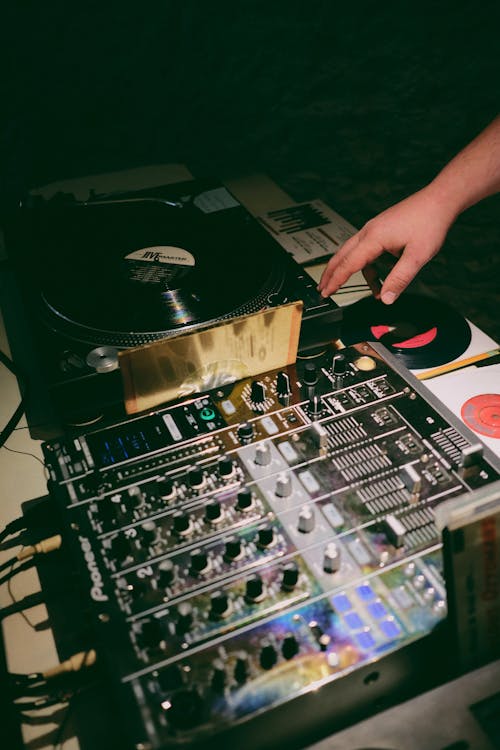 An Audio Mixer and a Vinyl Player on a Table