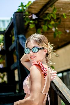 Woman posing in sunglasses outdoors during a sunny day in Adicora, Venezuela.