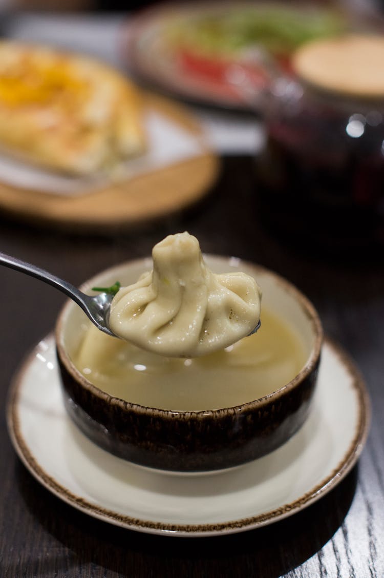 Photo Of A Khinkali On A Spoon