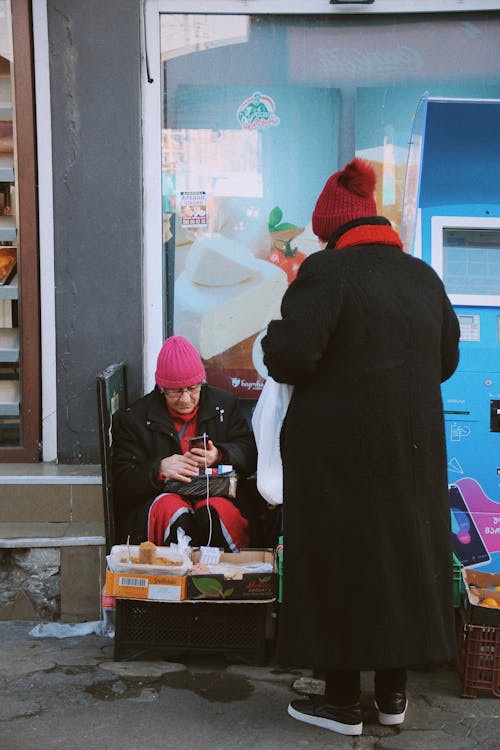 Street Vendor Using a Cellphone