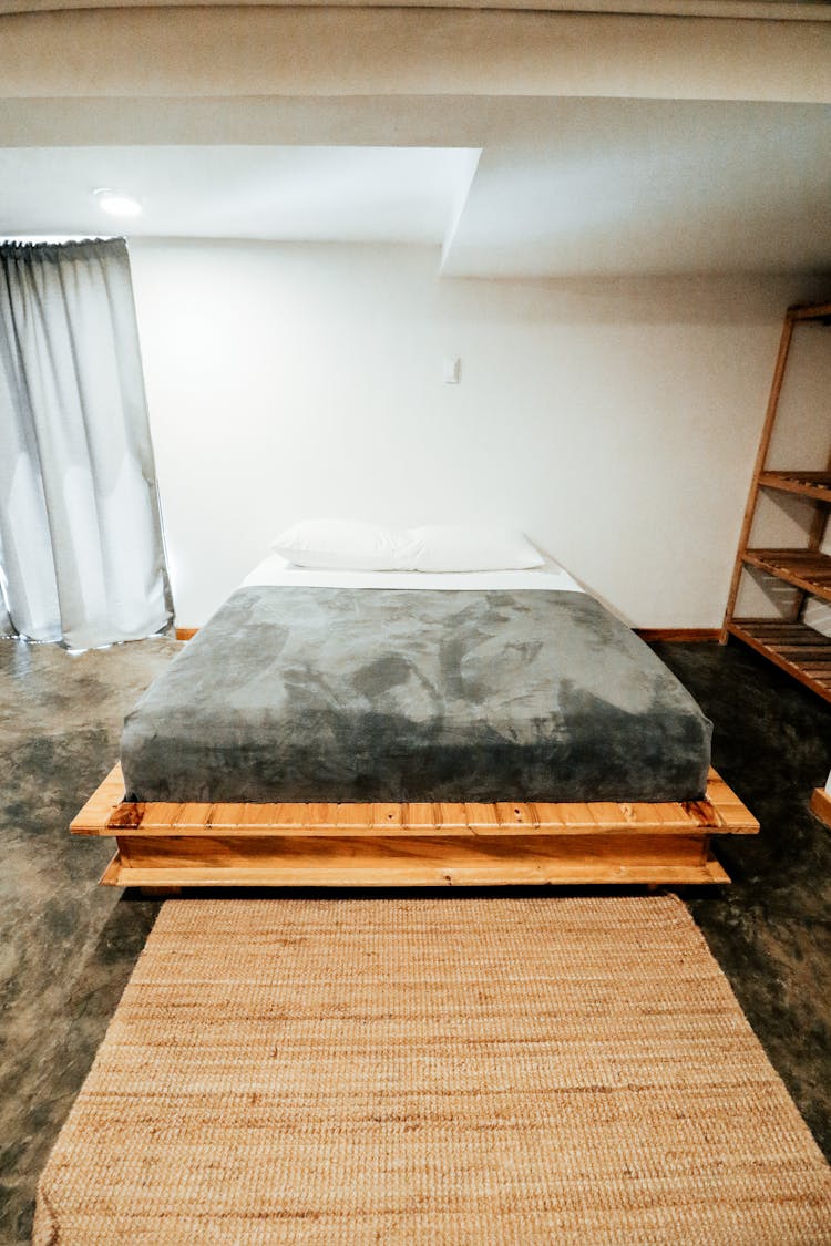 Wooden Bed Frame In The Bedroom