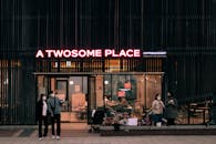 People Waiting in Front of a Café