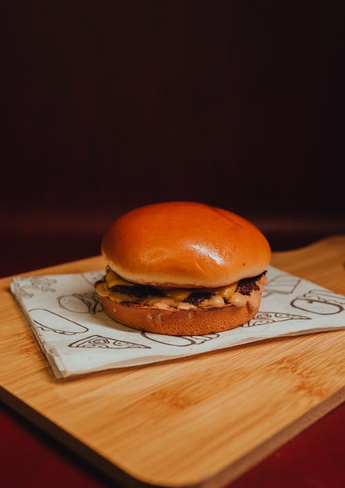 Free Hamburger on a Wooden Surface Stock Photo