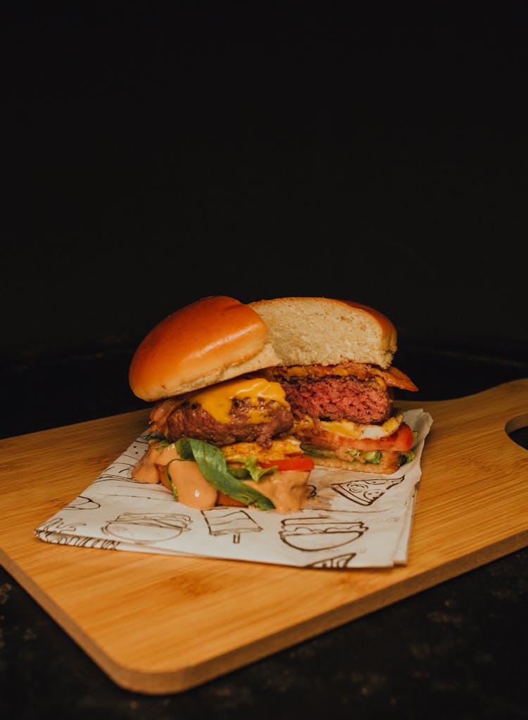 Sliced Burger On A Wooden Surface