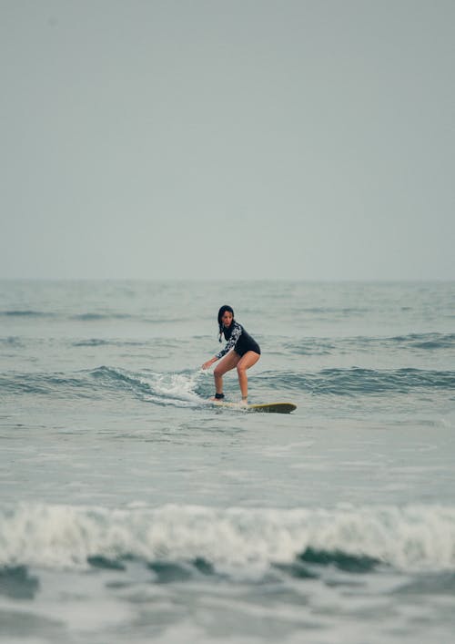 Free Woman Surfing on Waves Stock Photo