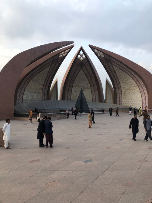 Free Visitors stroll around the Pakistan Monument, a symbol of unity in Islamabad. Stock Photo