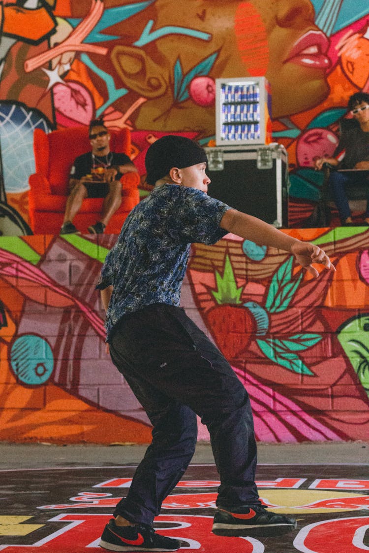 Man In Printed Shirt And Pants Dancing 