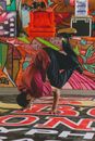 A Man in a Red Shirt Doing a Handstand