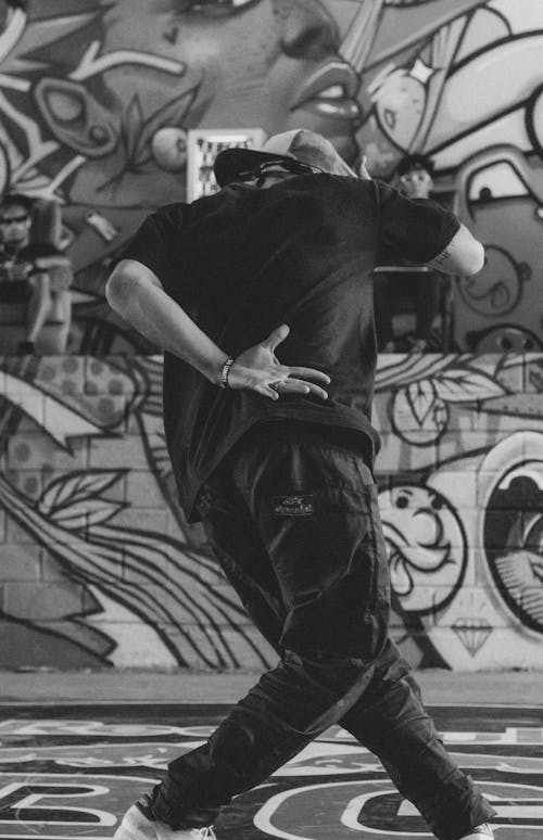 Black and White Photo of a Man Dancing