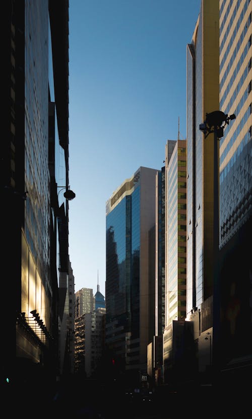 Безкоштовне стокове фото на тему «будівлі, вертикальні постріл, Захід сонця»