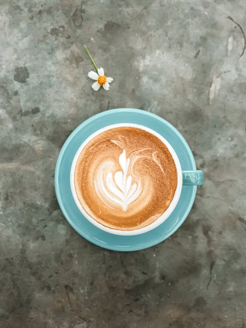 Close-Up Shot of Latte Art Coffee in Ceramic Cup