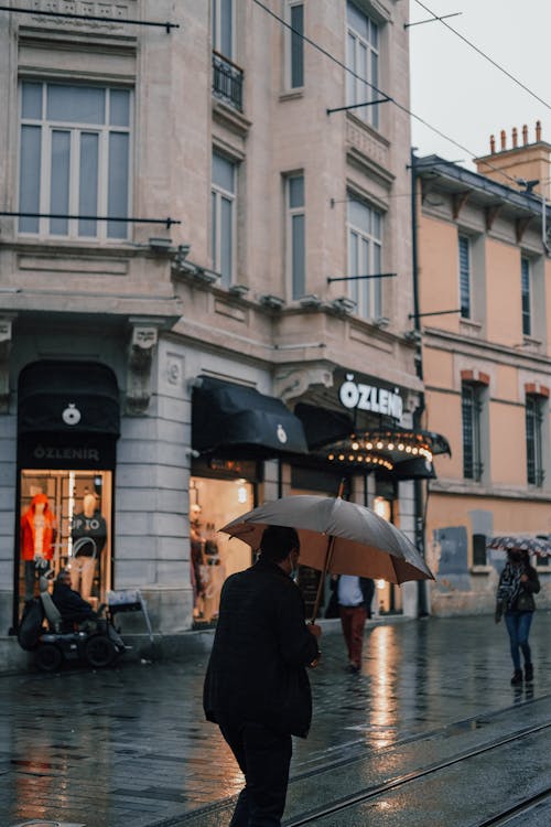 People Walking with Umbrellas