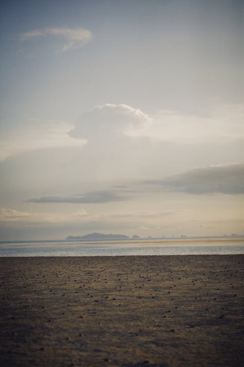 Beach under the Cloudy Sky