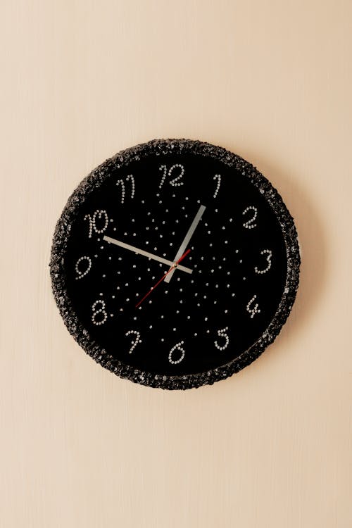 Close-Up Shot of a Black and White Wall Clock