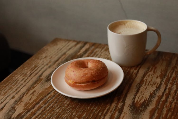 Donut On A Plate And A Cup Of Coffee