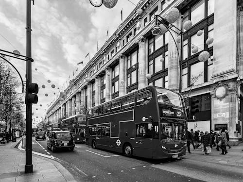Grayscale Photo of Double Decker Bus on Road