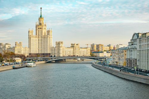 Free A view of Stalinist architecture by the Moscow River under a clear sky. Stock Photo