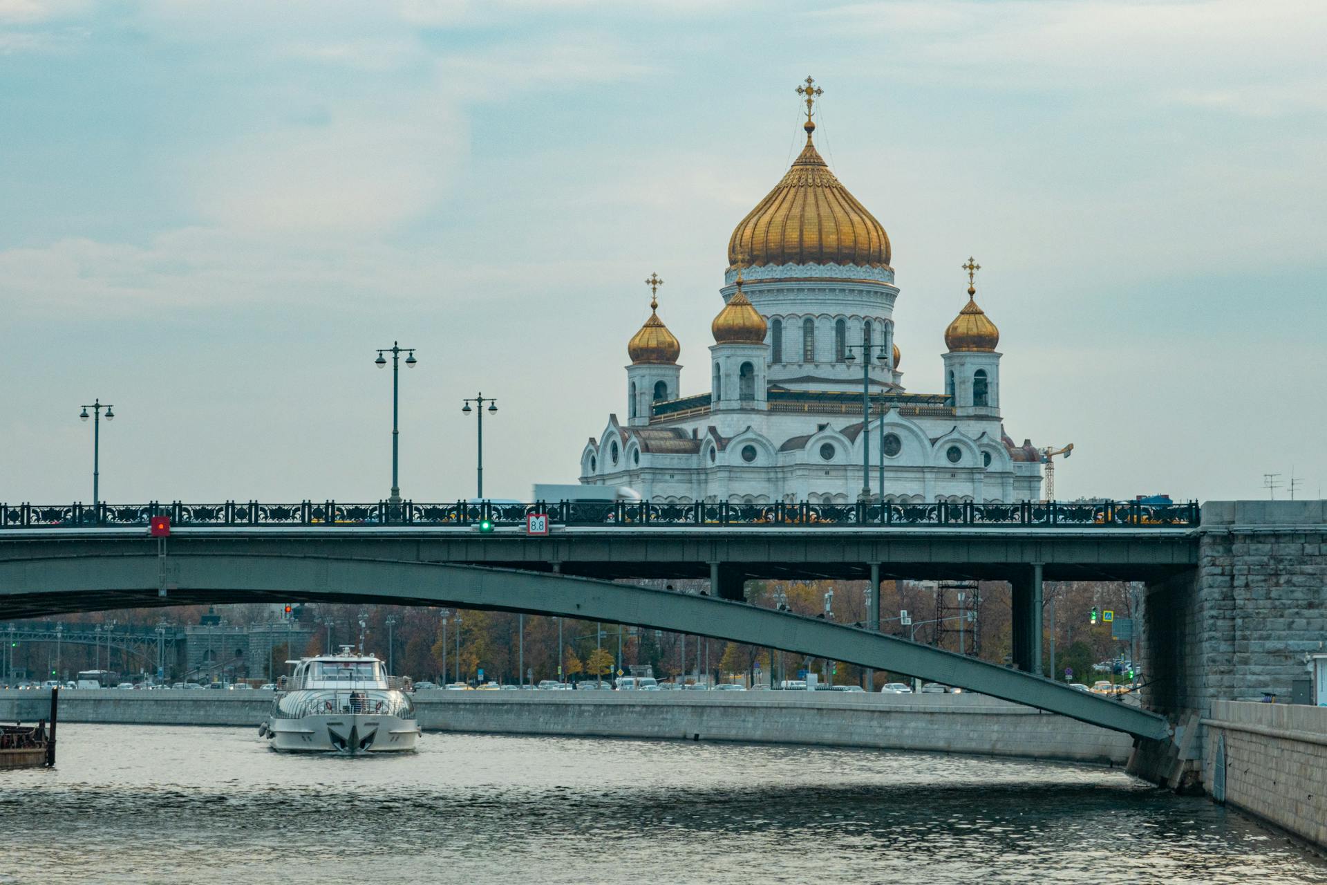 White Boat on Water Under the Bridge Near The Cathedral of Christ the Saviour of Moscow