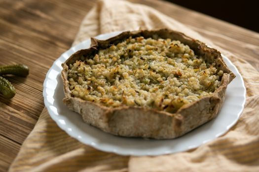 Close-up of a freshly baked savory rice pie, perfect for food photography.
