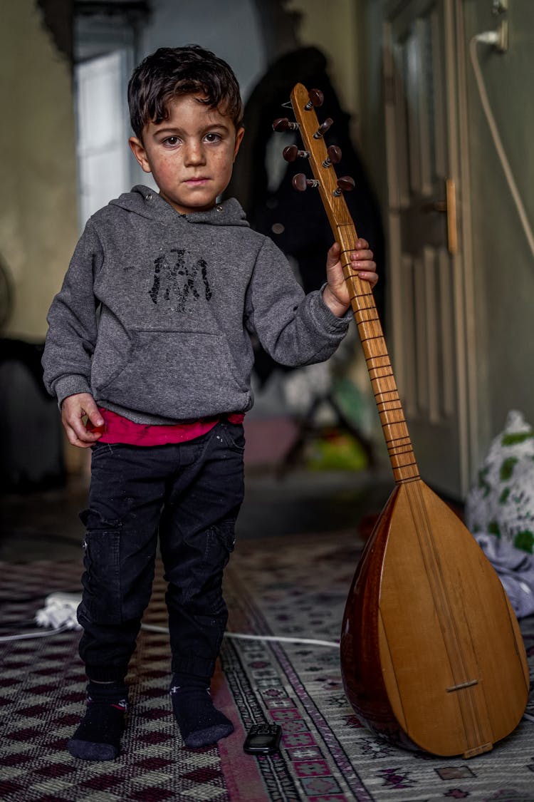 Little Boy Holding Turkish Saz