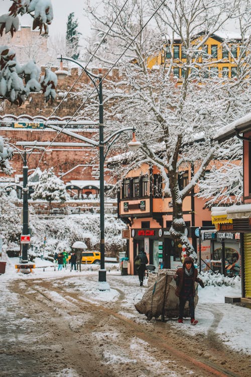 Busy People Walking on the Street During Winter