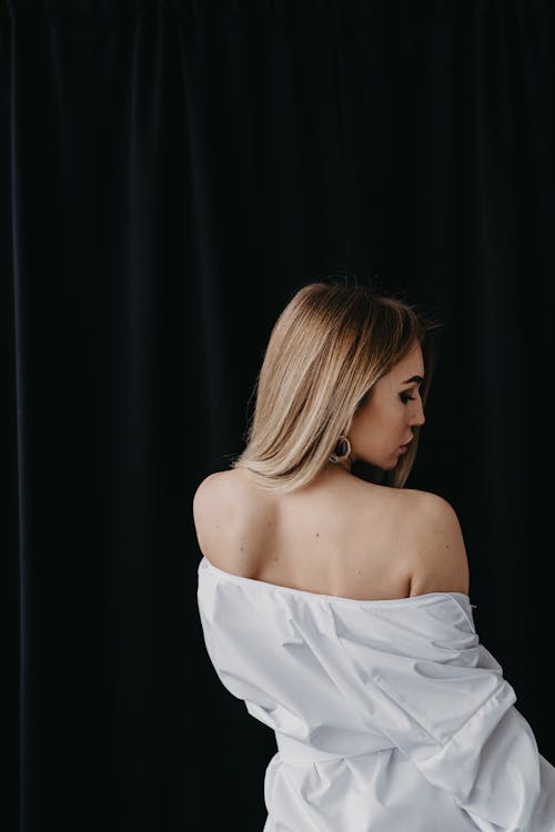 Back View of Woman in White Dress