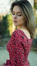 Woman in Red and Black Floral Off Shoulder Shirt