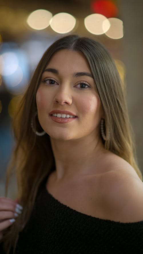 Woman in Off Shoulder Blouse Smiling