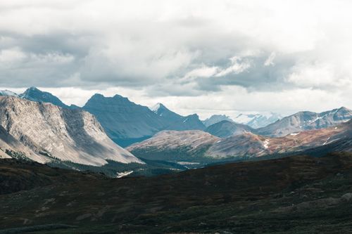 Free Dramatic mountain ranges under cloudy sky in Jasper National Park, Alberta, Canada. Stock Photo