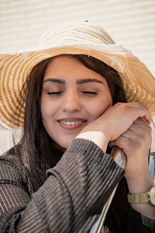 Portrait of a Woman Wearing a Sun Hat 