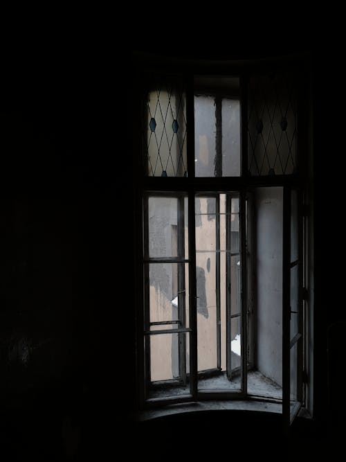 Open Window in a Dark Room 