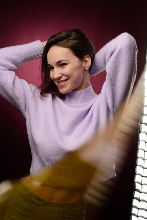 A Woman in Purple Sweater Smiling