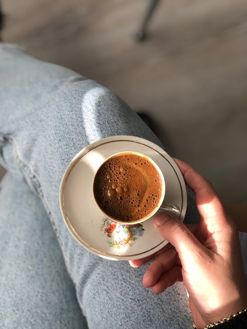 Free Unrecognizable Hand Holding Cup of Coffee  Stock Photo