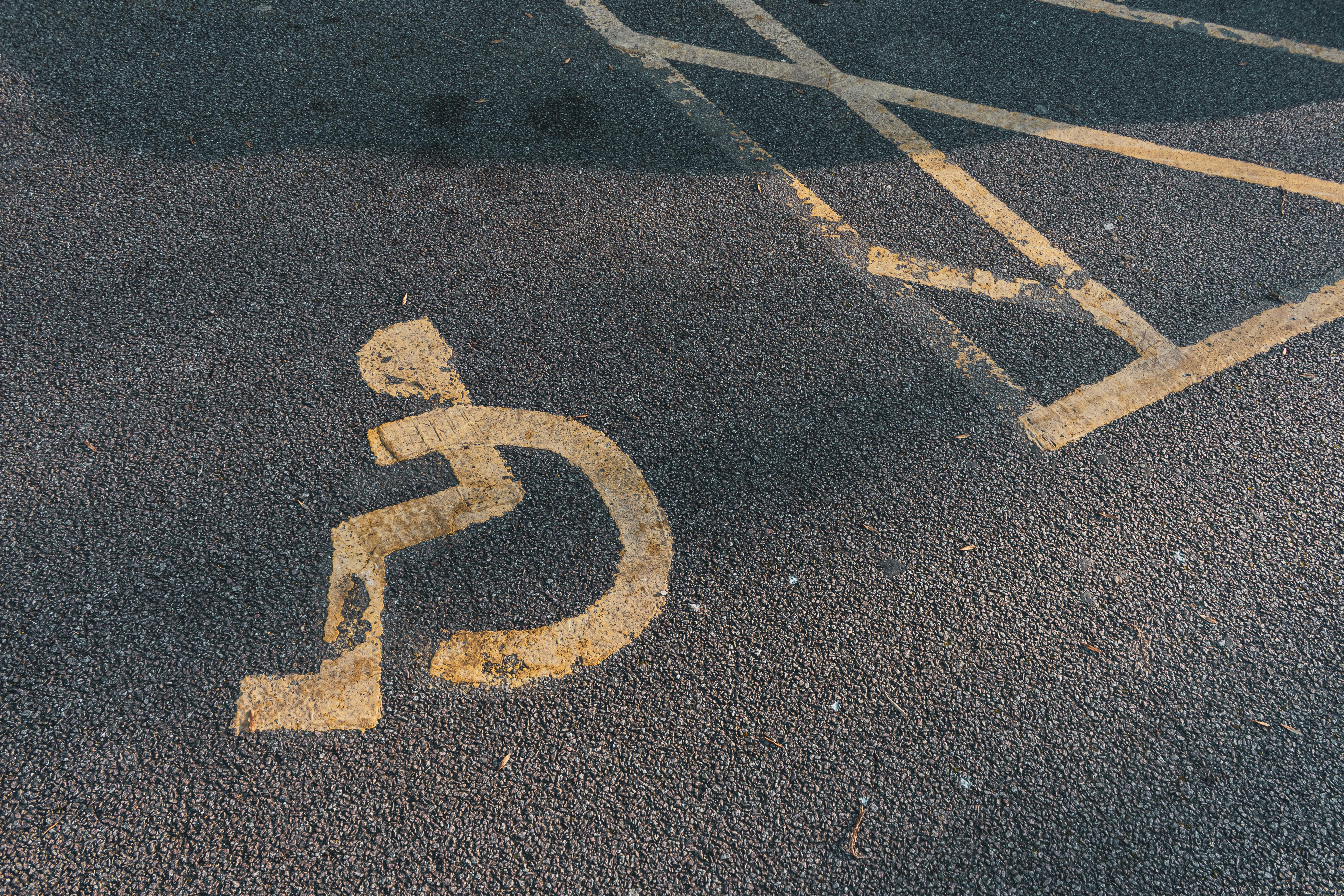 disability marking on asphalt pavement