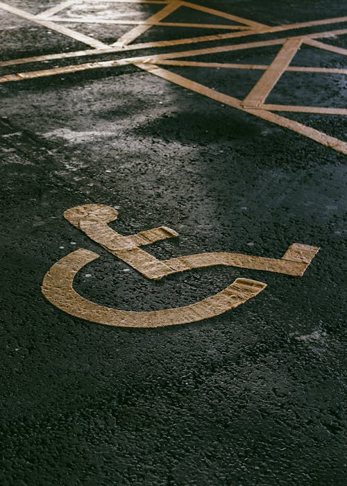 Disability Icon Painted on Asphalt Pavement