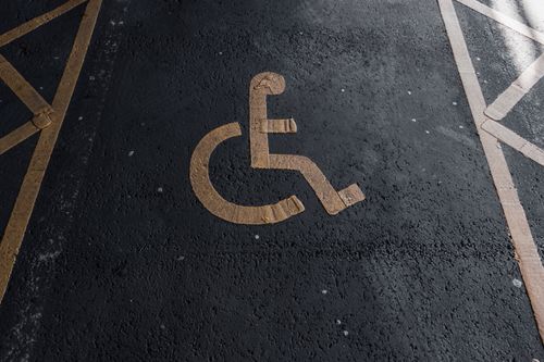 Free Close-up of a handicapped parking sign painted on pavement for accessibility clarity. Stock Photo