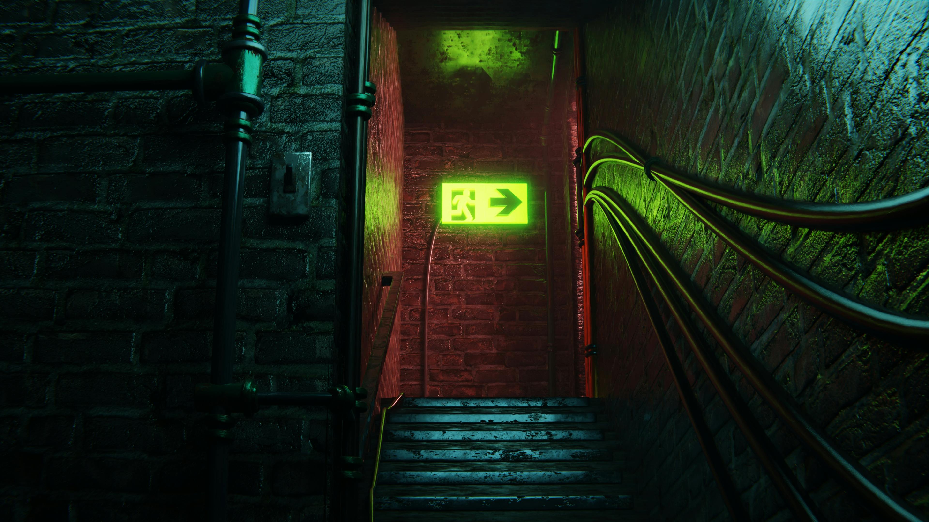 Dramatic staircase in a dark basement with an illuminated green exit sign.