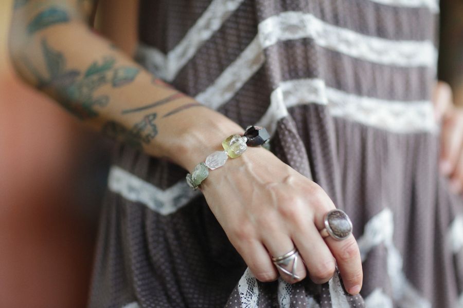 Stacked crystal bead bracelets on a wrist