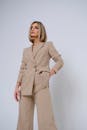 Blond Female Model Wearing Beige Ladies Suit