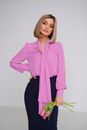 Handsome Blond Woman Wearing Pink Blouse and Black Tight Skirt Standing