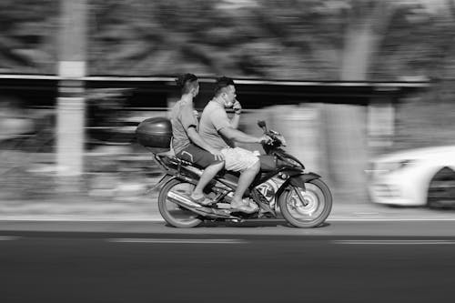 Free Grayscale Photo of Men Riding a Motorcycle Stock Photo