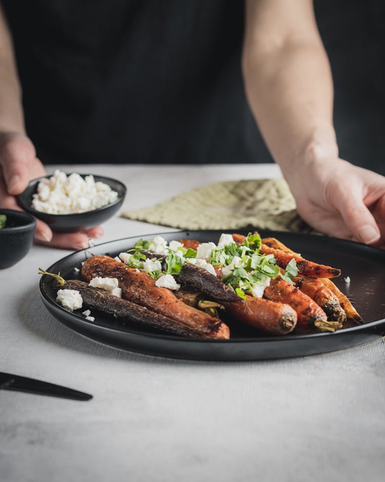 Photo Of A Plate With Roasted Carrots And Cheese