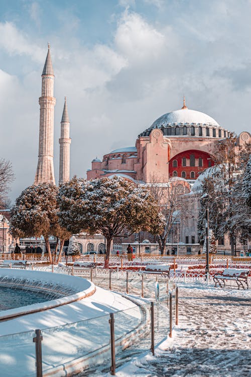 Hagia Sophia Mosque Near Green Trees Under Cloudy Sky